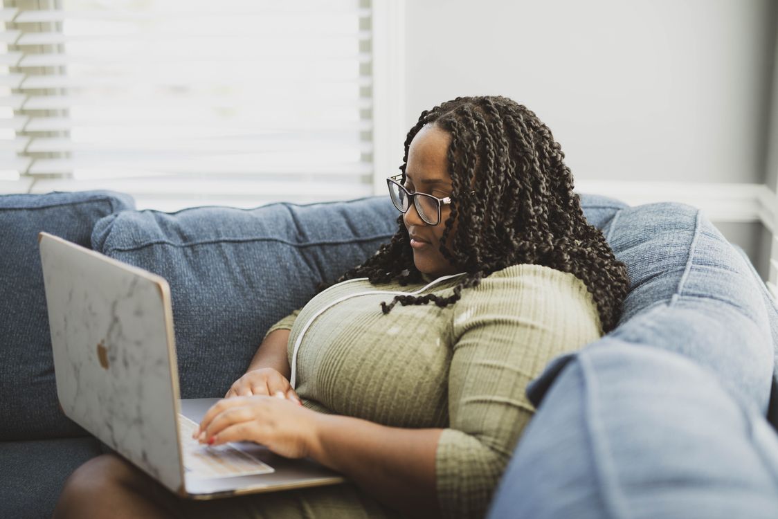 Productive Woman Working from Home with Laptop